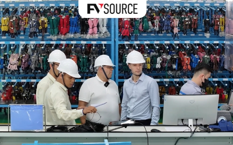 Foreign professionals visiting a manufacturing facility during operational setup in Vietnam.